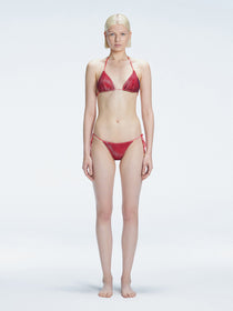 Front view of model wearing Hermione Red Optical Bikini Set with triangle shape and 3D printed design.
