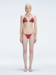 Front view of model wearing Hermione Red Optical Bikini Set with triangle shape and 3D printed design.
