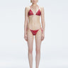 Front view of model wearing Hermione Red Optical Bikini Set with triangle shape and 3D printed design.
