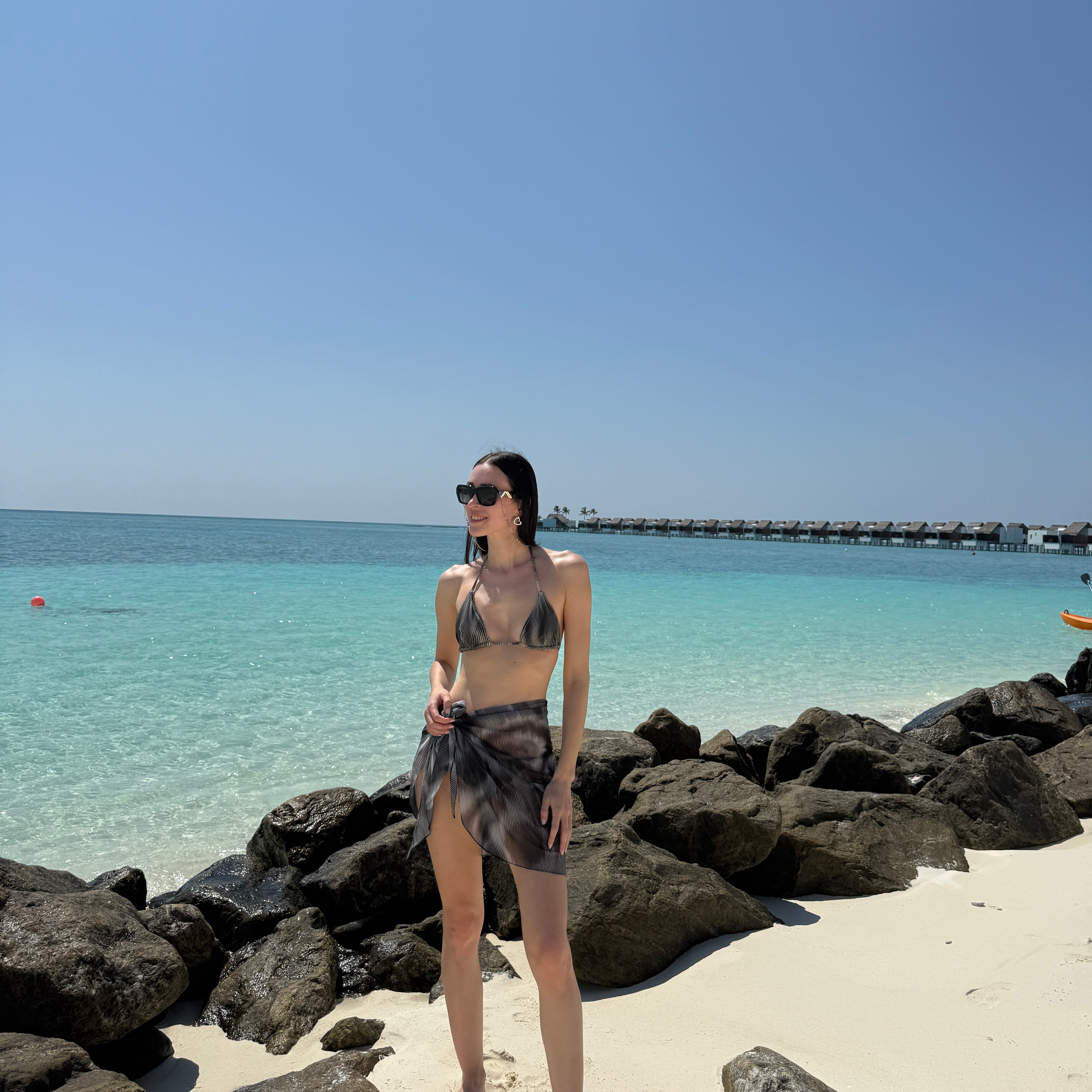 Elvira Jain - Hermione Black Triangle Side Tie 3D Bikini Set - Evita Black Optical Tie Side Sarong | Moeva | Bikini Set | Each week unveils new pieces—luxury swimwear, fluid resort silhouettes, and elevated summer-to-evening essentials designed to carry you from coastal escapes to city nights.