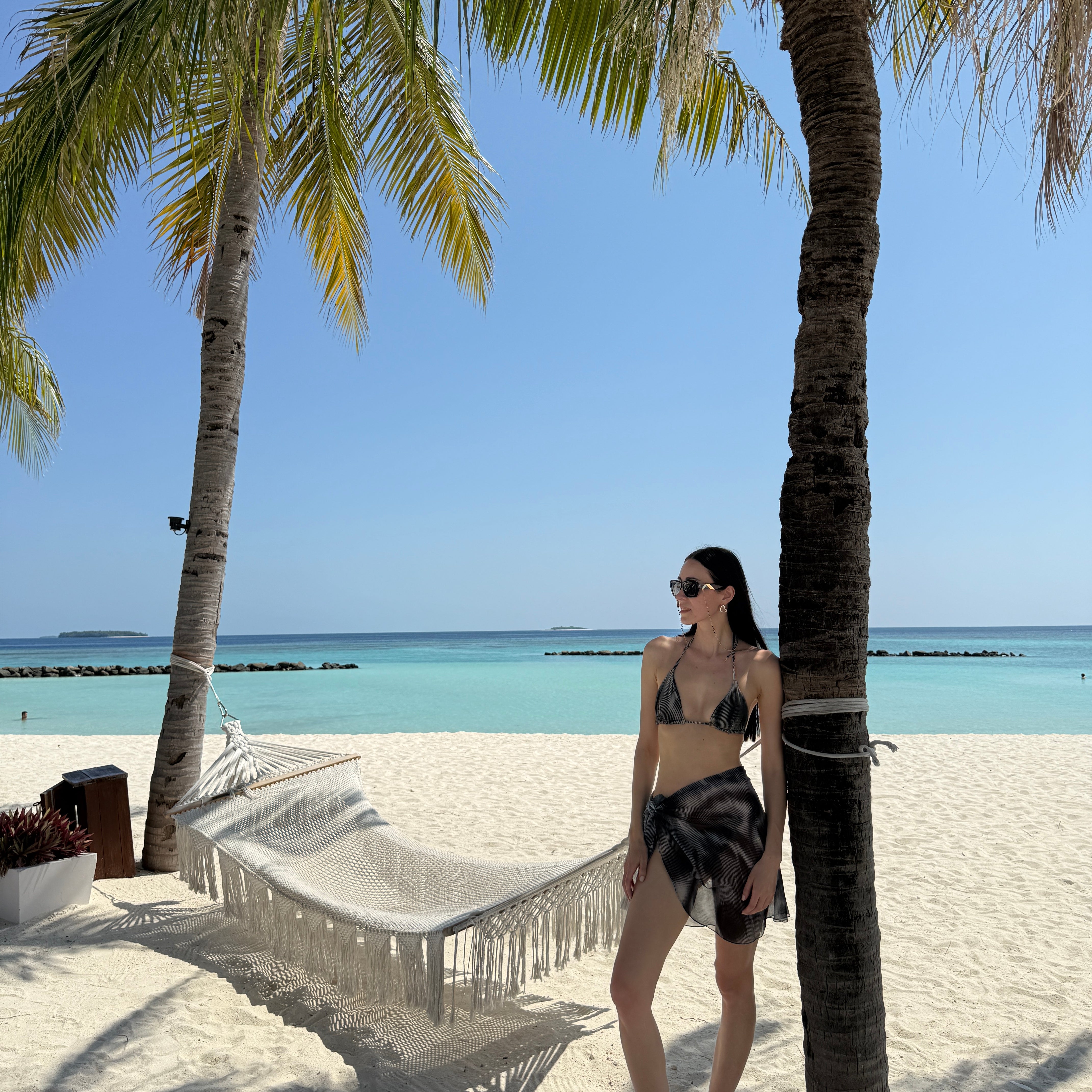 Elvira Jain - Hermione Black Triangle Side Tie 3D Bikini Set - Evita Black Optical Tie Side Sarong | Moeva | Bikini Set | Each week unveils new pieces—luxury swimwear, fluid resort silhouettes, and elevated summer-to-evening essentials designed to carry you from coastal escapes to city nights.