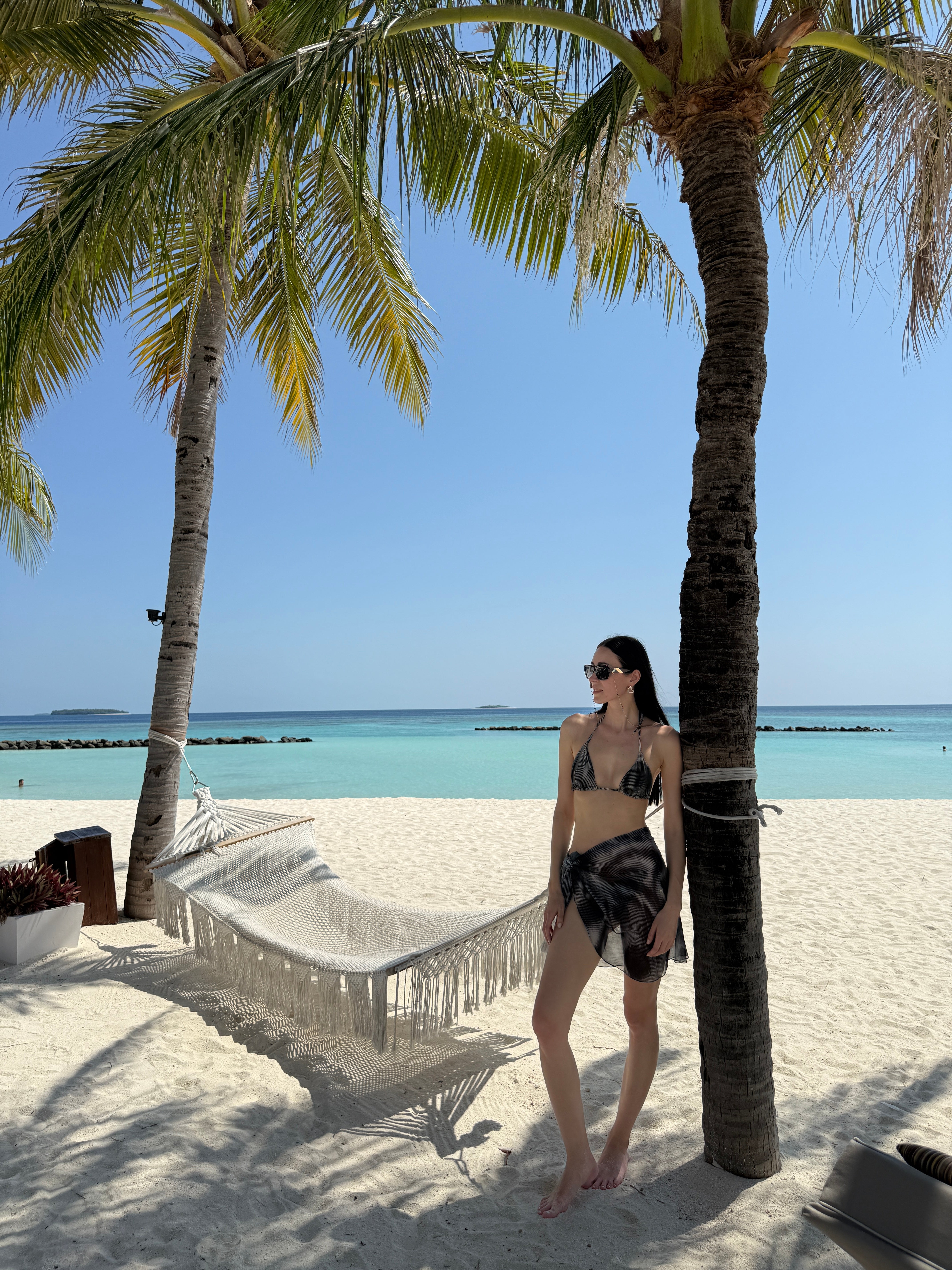 Elvira Jain - Hermione Black Triangle Side Tie 3D Bikini Set - Evita Black Optical Tie Side Sarong | Moeva | Bikini Set | Each week unveils new pieces—luxury swimwear, fluid resort silhouettes, and elevated summer-to-evening essentials designed to carry you from coastal escapes to city nights.