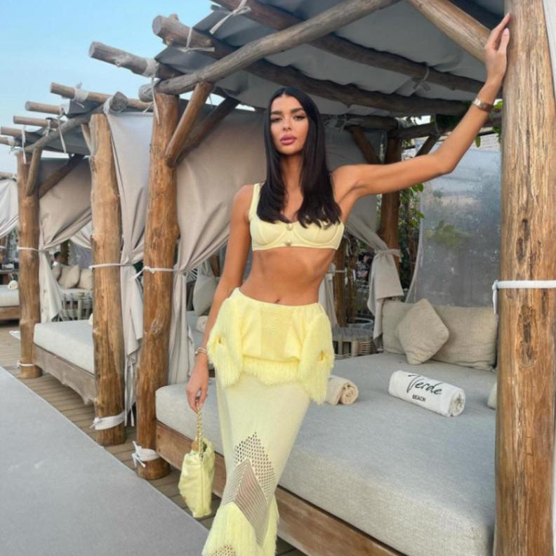 SIOBHAN PERRY-Maris Yellow Knitted Maxi Dress with Fringe and Open Back | Moeva | Set | Each week unveils new pieces—luxury swimwear, fluid resort silhouettes, and elevated summer-to-evening essentials designed to carry you from coastal escapes to city nights.
