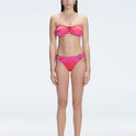 "Model wearing the Ilana Gradient Bikini Bottom from the front, showcasing the chic bandeau style and elegant buckle detail."
