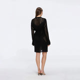 Kenga Knitted Knee-Length Long-Sleeve Belted Black Kaftan | Moeva | Kaftans | Each week unveils new pieces—luxury swimwear, fluid resort silhouettes, and elevated summer-to-evening essentials designed to carry you from coastal escapes to city nights.