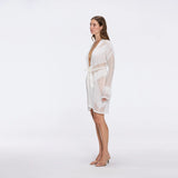 Kenga Knitted Knee-Length Long-Sleeve Belted White Kaftan | Moeva | Kaftans | Each week unveils new pieces—luxury swimwear, fluid resort silhouettes, and elevated summer-to-evening essentials designed to carry you from coastal escapes to city nights.