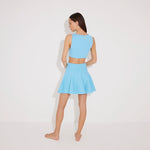Lanao Blue Cut-Out Knit Mini Dress with Gold Detail | Moeva | RTW Dresses | Each week unveils new pieces—luxury swimwear, fluid resort silhouettes, and elevated summer-to-evening essentials designed to carry you from coastal escapes to city nights.