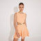 Lanao Orange Cut-Out Knit Mini Dress with Gold Detail | Moeva | RTW Dresses | Each week unveils new pieces—luxury swimwear, fluid resort silhouettes, and elevated summer-to-evening essentials designed to carry you from coastal escapes to city nights.
