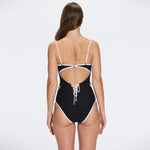Lourmarin Black Underwired Gold Button Detail Swimsuit | Moeva | Swimsuit | Each week unveils new pieces—luxury swimwear, fluid resort silhouettes, and elevated summer-to-evening essentials designed to carry you from coastal escapes to city nights.