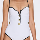 Lourmarin White Underwired Gold Button Detail Swimsuit | Moeva | Swimsuit | Each week unveils new pieces—luxury swimwear, fluid resort silhouettes, and elevated summer-to-evening essentials designed to carry you from coastal escapes to city nights.