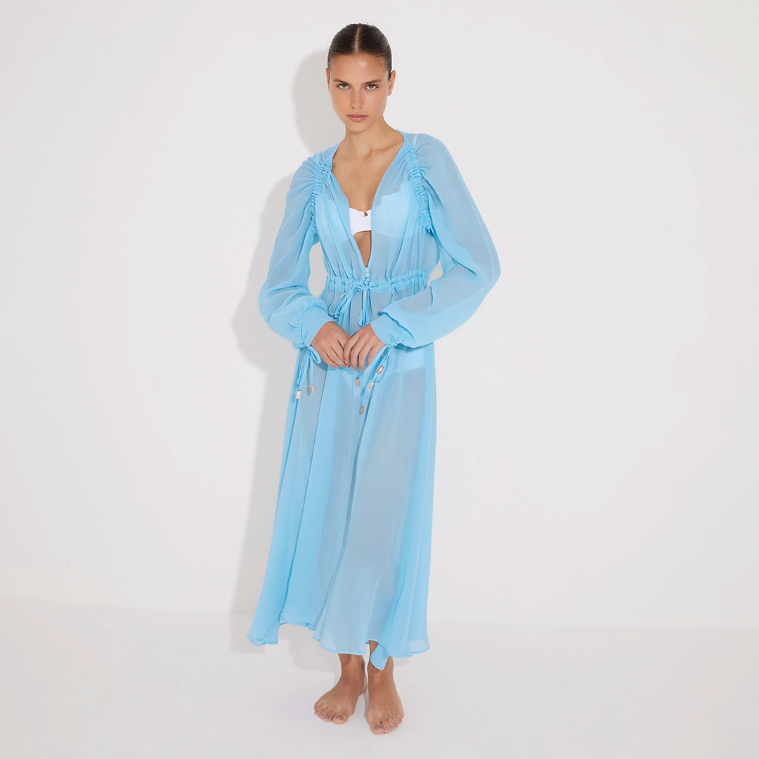 Lula Silk Blouson-Sleeve Belted Sheer Blue Maxi Dress | Moeva | Beachwear Dresses | Each week unveils new pieces—luxury swimwear, fluid resort silhouettes, and elevated summer-to-evening essentials designed to carry you from coastal escapes to city nights.