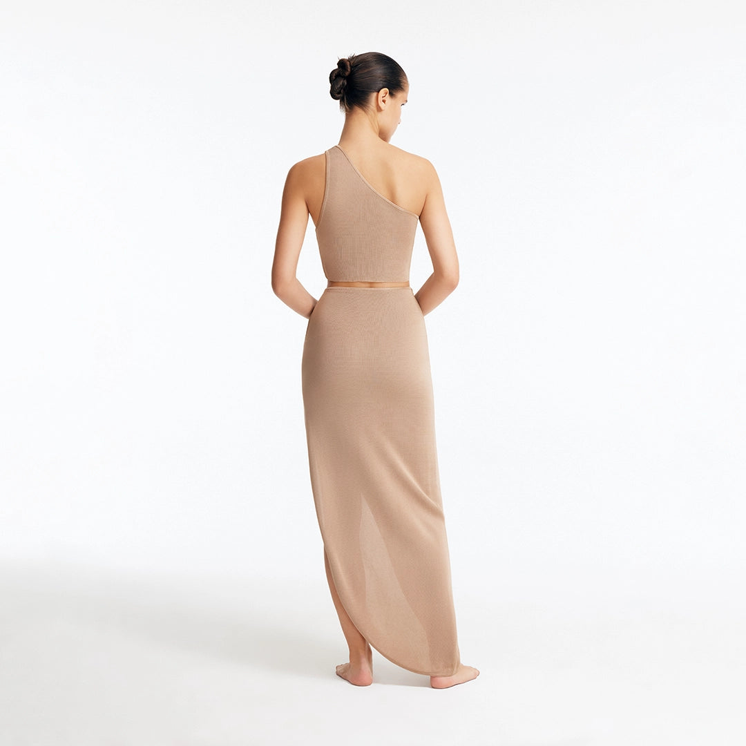 Eila Bronze One Shoulder Knitted Crop Top and Lyndon Bronze Knitted Skirt with Side Slit | Moeva | Set | Each week unveils new pieces—luxury swimwear, fluid resort silhouettes, and elevated summer-to-evening essentials designed to carry you from coastal escapes to city nights.