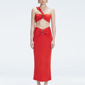 Front view of model wearing Esmeralda Red Midi Skirt with ruched and buckle detailing.
