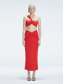 Front view of model wearing Esmeralda Red Midi Skirt with ruched and buckle detailing.
