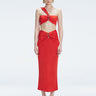 Front view of model wearing Esmeralda Red Midi Skirt with ruched and buckle detailing.
