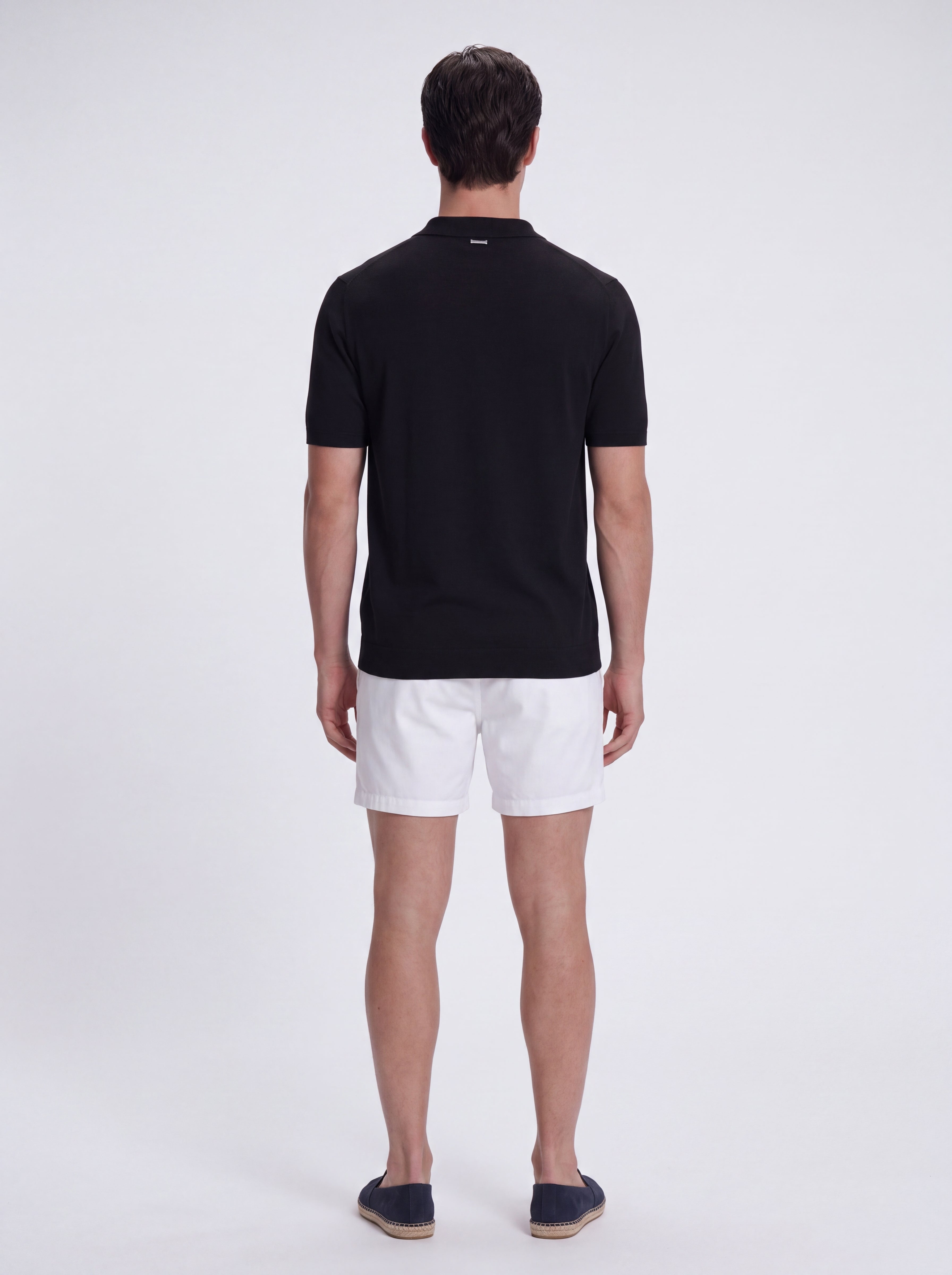 Lars Black Polo Shirt with Button Fastening | Moeva | T-Shirt | Each week unveils new pieces—luxury swimwear, fluid resort silhouettes, and elevated summer-to-evening essentials designed to carry you from coastal escapes to city nights.