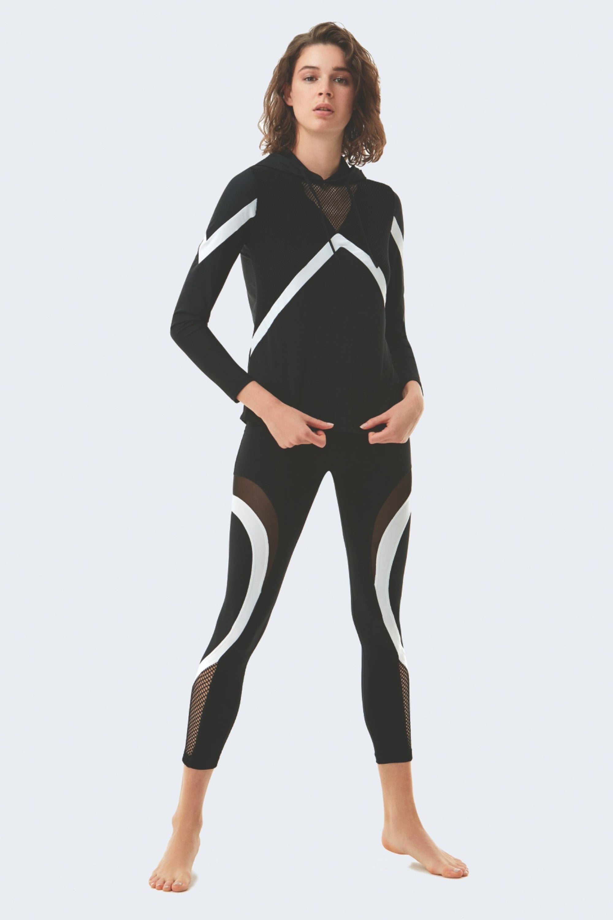 Laura Black/White Hoodie | Moeva | Activewear | Each week unveils new pieces—luxury swimwear, fluid resort silhouettes, and elevated summer-to-evening essentials designed to carry you from coastal escapes to city nights.