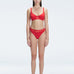 "Model wearing the Lorelai Red Bikini Set with a scoop neck and mesh detailing, posing by the pool."
