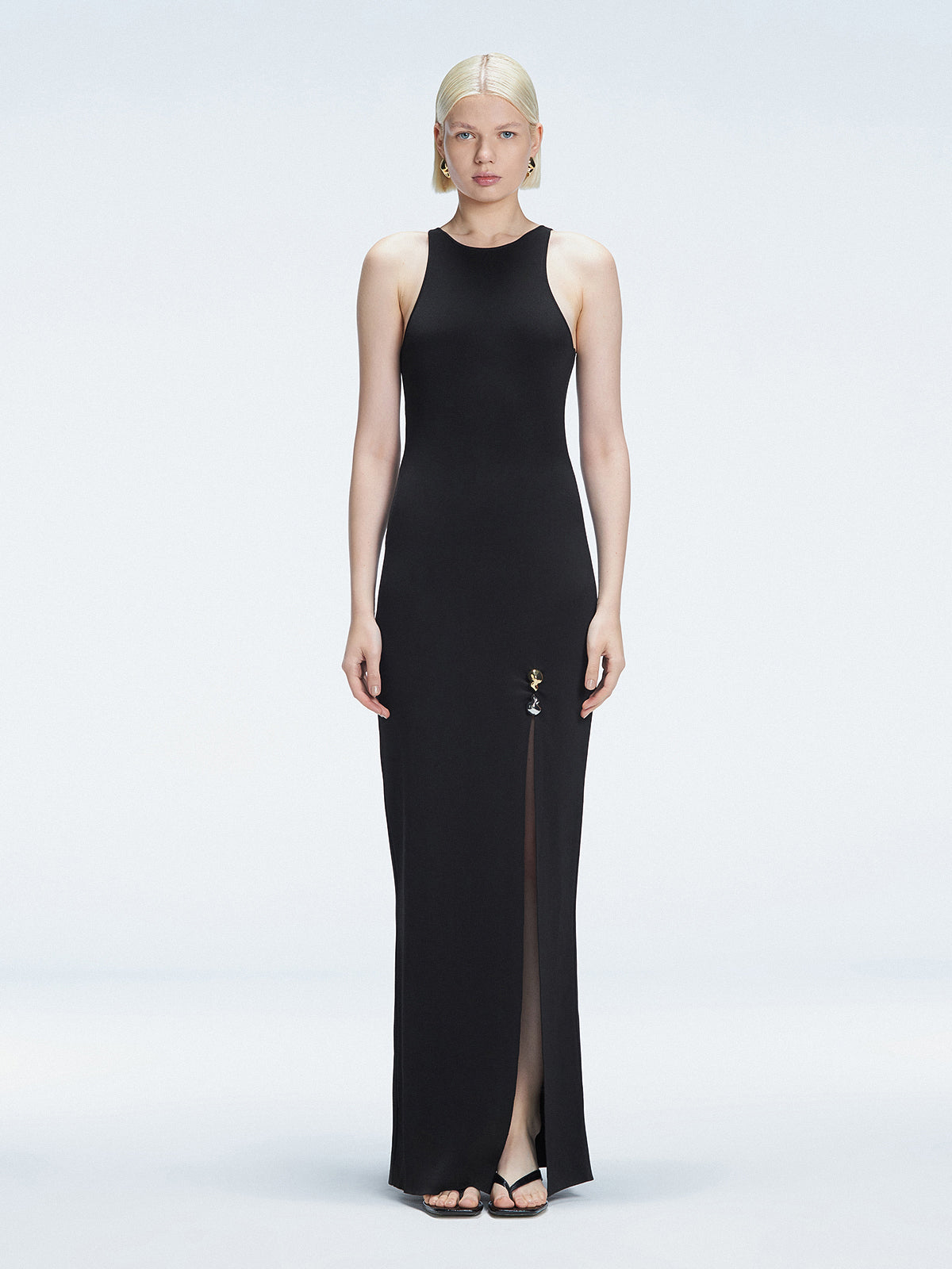 Front view of model wearing Louisa Black Maxi Dress with high neck, sleeveless design, and buckle detail.
