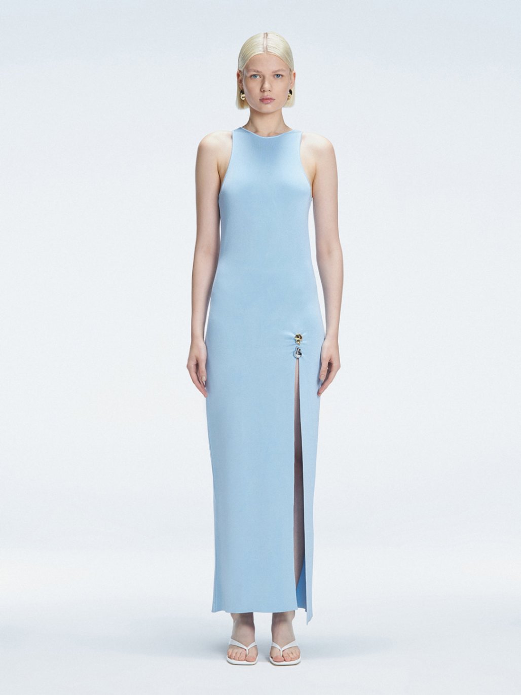 Front view of model wearing Louisa Baby Blue Maxi Dress with high neck, sleeveless design, and buckle detail.
