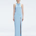 Front view of model wearing Louisa Baby Blue Maxi Dress with high neck, sleeveless design, and buckle detail.
