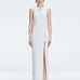 Front view of model wearing Louisa White Maxi Dress with high neck, sleeveless design, and buckle detail.
