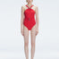 Model wearing the Lyra Red Underwired Swimsuit with ruched front and moderate bottom coverage.
