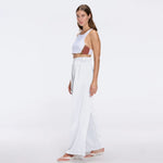 Manami White High Waist Wide Leg Pants | Moeva | Women RTW Pants | Each week unveils new pieces—luxury swimwear, fluid resort silhouettes, and elevated summer-to-evening essentials designed to carry you from coastal escapes to city nights.