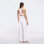 Manami White High Waist Wide Leg Pants | Moeva | Women RTW Pants | Each week unveils new pieces—luxury swimwear, fluid resort silhouettes, and elevated summer-to-evening essentials designed to carry you from coastal escapes to city nights.