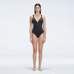 Marina Black V Neck Swimsuit | Moeva | One-Piece | Each week unveils new pieces—luxury swimwear, fluid resort silhouettes, and elevated summer-to-evening essentials designed to carry you from coastal escapes to city nights.