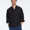 Man wearing a black shirt and blue pants on a white background