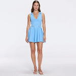 Meditara Blue Knit Mini Dress with Flared Skirt and Gold Button Details | Moeva | RTW Dresses | Each week unveils new pieces—luxury swimwear, fluid resort silhouettes, and elevated summer-to-evening essentials designed to carry you from coastal escapes to city nights.