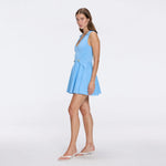 Meditara Blue Knit Mini Dress with Flared Skirt and Gold Button Details | Moeva | RTW Dresses | Each week unveils new pieces—luxury swimwear, fluid resort silhouettes, and elevated summer-to-evening essentials designed to carry you from coastal escapes to city nights.