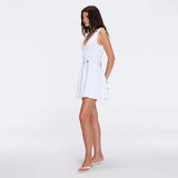 Meditara White Knit Mini Dress with Flared Skirt and Gold Button Details | Moeva | RTW Dresses | Each week unveils new pieces—luxury swimwear, fluid resort silhouettes, and elevated summer-to-evening essentials designed to carry you from coastal escapes to city nights.