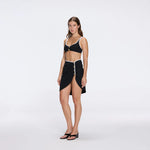Mirazur Gold Buttoned High-Waist Mini Black Skirt | Moeva | Beachwear Skirts | Each week unveils new pieces—luxury swimwear, fluid resort silhouettes, and elevated summer-to-evening essentials designed to carry you from coastal escapes to city nights.