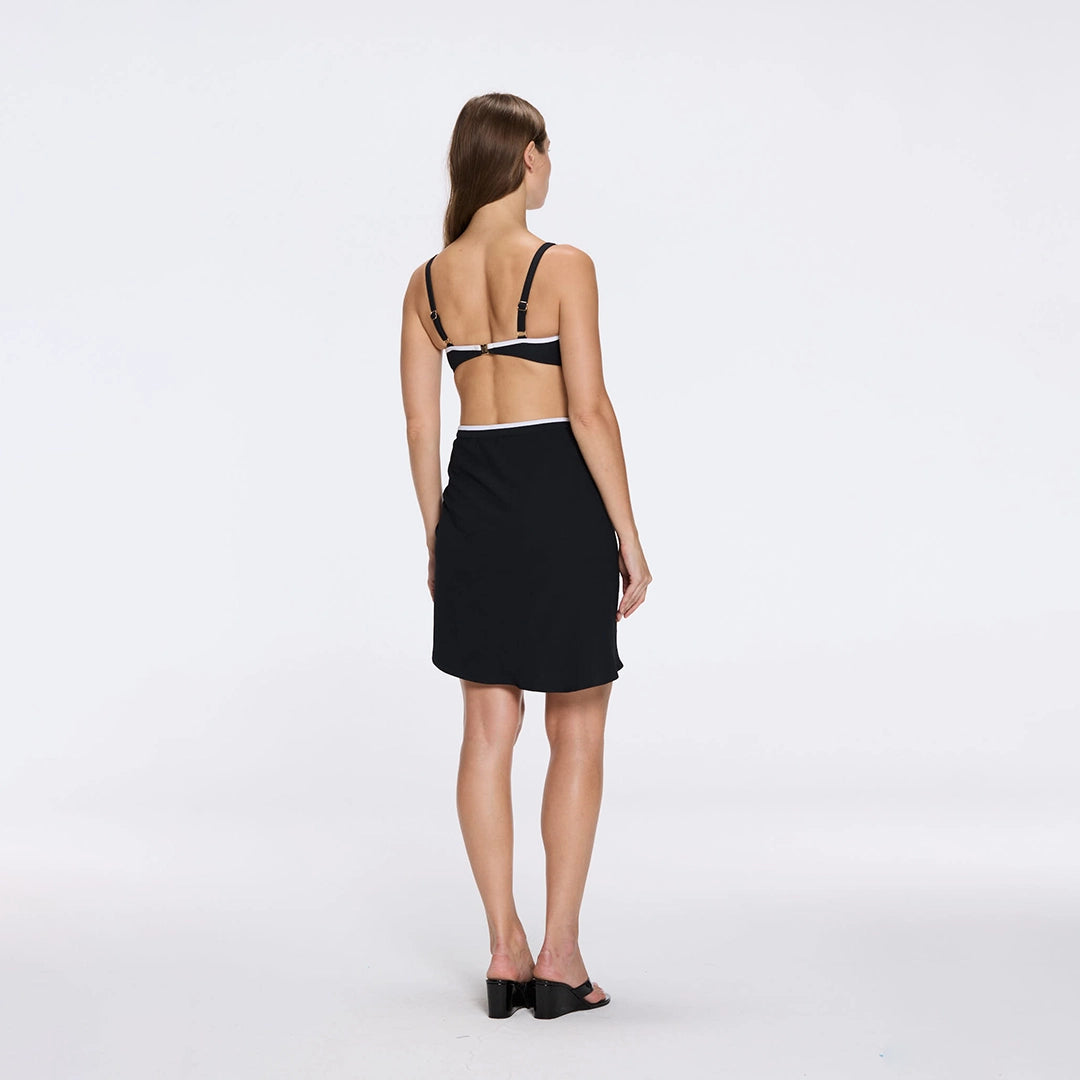 Mirazur Gold Buttoned High-Waist Mini Black Skirt | Moeva | Beachwear Skirts | Each week unveils new pieces—luxury swimwear, fluid resort silhouettes, and elevated summer-to-evening essentials designed to carry you from coastal escapes to city nights.
