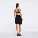 Mirazur Gold Buttoned High-Waist Mini Black Skirt | Moeva | Beachwear Skirts | Each week unveils new pieces—luxury swimwear, fluid resort silhouettes, and elevated summer-to-evening essentials designed to carry you from coastal escapes to city nights.