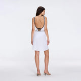 Mirazur Gold Buttoned High-Waist Mini White Skirt | Moeva | Beachwear Skirts | Each week unveils new pieces—luxury swimwear, fluid resort silhouettes, and elevated summer-to-evening essentials designed to carry you from coastal escapes to city nights.