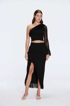 Alani Black Fringe Detail Asymmetric Slit Midi Skirt | Moeva | RTW Skirts | Each week unveils new pieces—luxury swimwear, fluid resort silhouettes, and elevated summer-to-evening essentials designed to carry you from coastal escapes to city nights.
