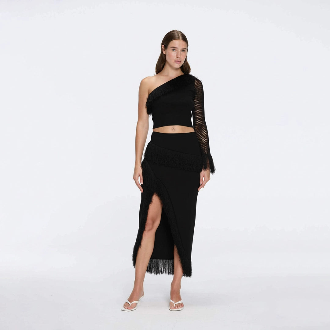 Alani Black Fringe Detail Asymmetric Slit Midi Skirt | Moeva | RTW Skirts | Each week unveils new pieces—luxury swimwear, fluid resort silhouettes, and elevated summer-to-evening essentials designed to carry you from coastal escapes to city nights.
