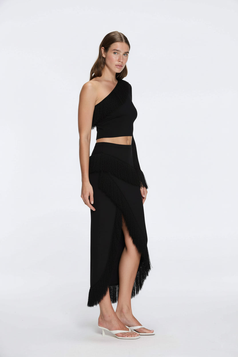 Monroe & Alani Fringe Asymmetric Knit Black Set | Moeva | | Each week unveils new pieces—luxury swimwear, fluid resort silhouettes, and elevated summer-to-evening essentials designed to carry you from coastal escapes to city nights.