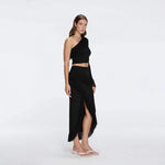 Alani Black Fringe Detail Asymmetric Slit Midi Skirt | Moeva | RTW Skirts | Each week unveils new pieces—luxury swimwear, fluid resort silhouettes, and elevated summer-to-evening essentials designed to carry you from coastal escapes to city nights.