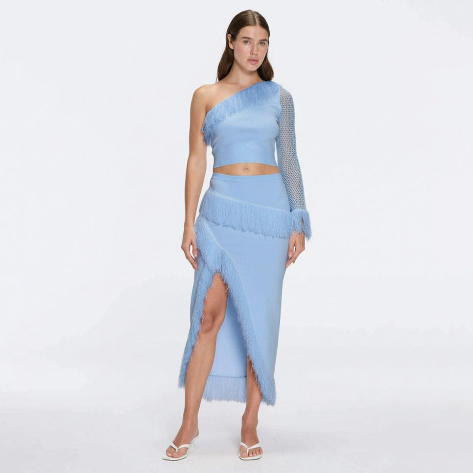 Monroe Blue One-Shoulder Knit Top with Fringe & Mesh Sleeve | Moeva | RTW Bustiers | Each week unveils new pieces—luxury swimwear, fluid resort silhouettes, and elevated summer-to-evening essentials designed to carry you from coastal escapes to city nights.