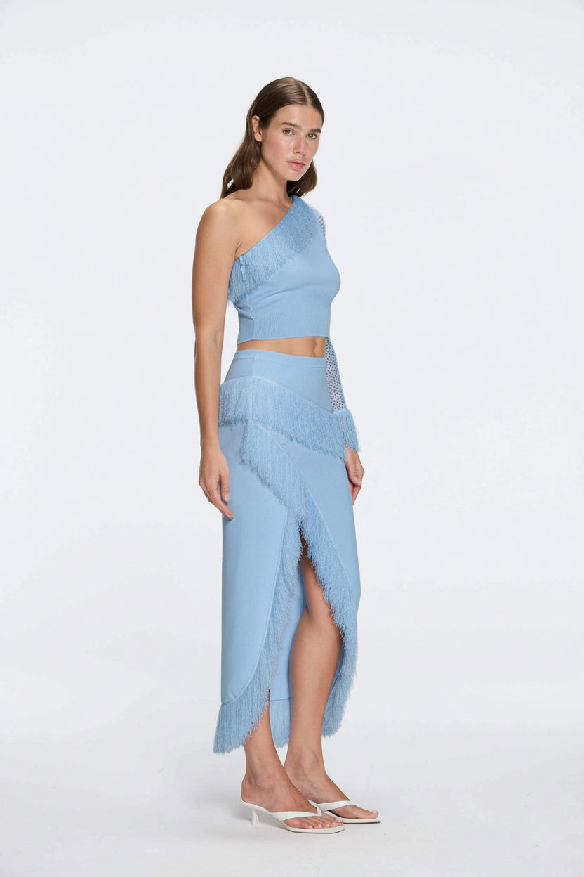 Monroe & Alani Fringe Asymmetric Knit Blue Set | Moeva | | Each week unveils new pieces—luxury swimwear, fluid resort silhouettes, and elevated summer-to-evening essentials designed to carry you from coastal escapes to city nights.