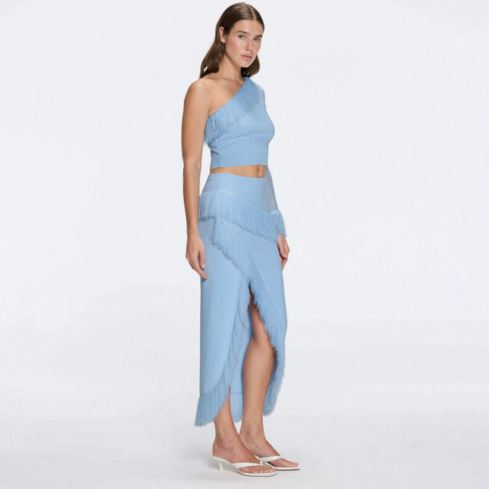 Alani Blue Fringe Detail Asymmetric Slit Midi Skirt | Moeva | Skirt | Each week unveils new pieces—luxury swimwear, fluid resort silhouettes, and elevated summer-to-evening essentials designed to carry you from coastal escapes to city nights.