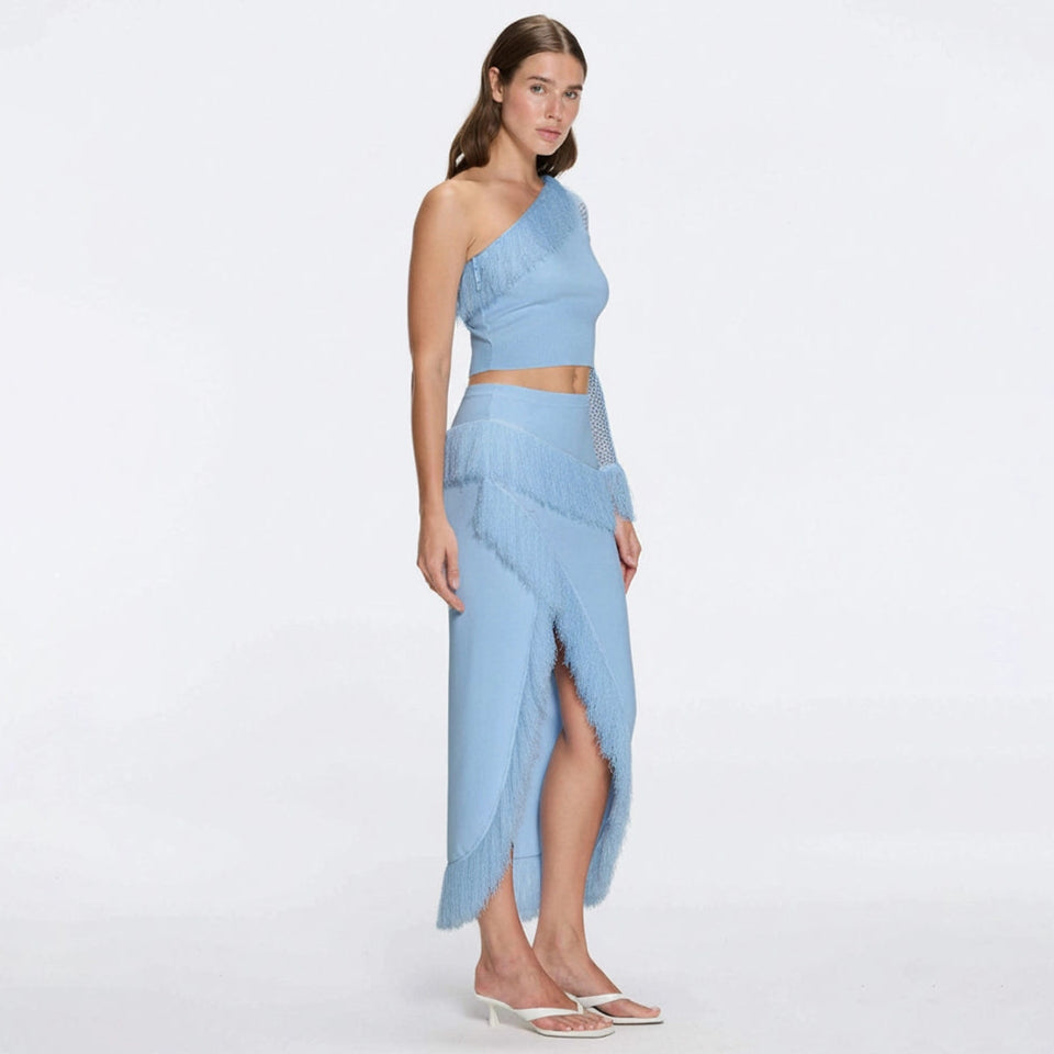 Monroe Blue One-Shoulder Knit Top with Fringe & Mesh Sleeve | Moeva | RTW Bustiers | Each week unveils new pieces—luxury swimwear, fluid resort silhouettes, and elevated summer-to-evening essentials designed to carry you from coastal escapes to city nights.