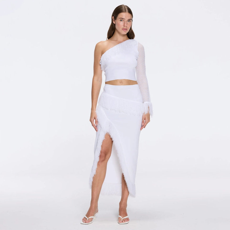 Monroe White One-Shoulder Knit Top with Fringe & Mesh Sleeve | Moeva | RTW Bustiers | Each week unveils new pieces—luxury swimwear, fluid resort silhouettes, and elevated summer-to-evening essentials designed to carry you from coastal escapes to city nights.