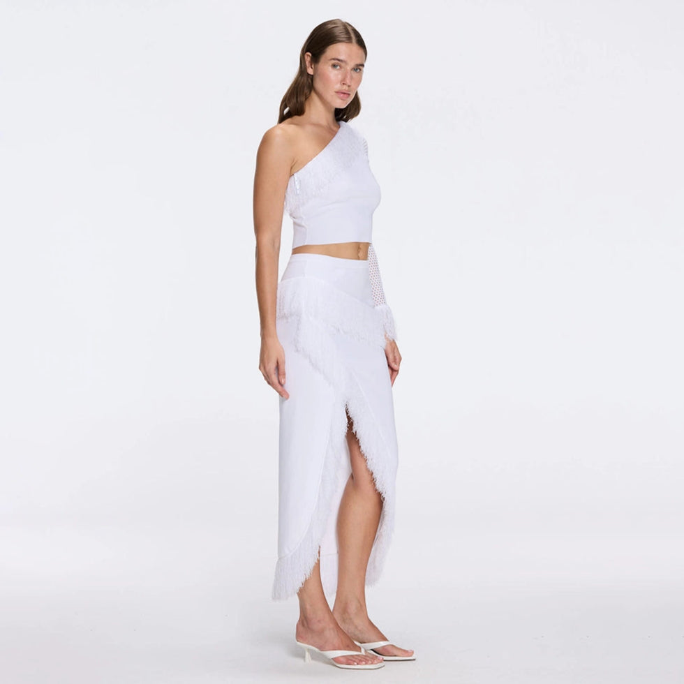 Monroe White One-Shoulder Knit Top with Fringe & Mesh Sleeve | Moeva | RTW Bustiers | Each week unveils new pieces—luxury swimwear, fluid resort silhouettes, and elevated summer-to-evening essentials designed to carry you from coastal escapes to city nights.