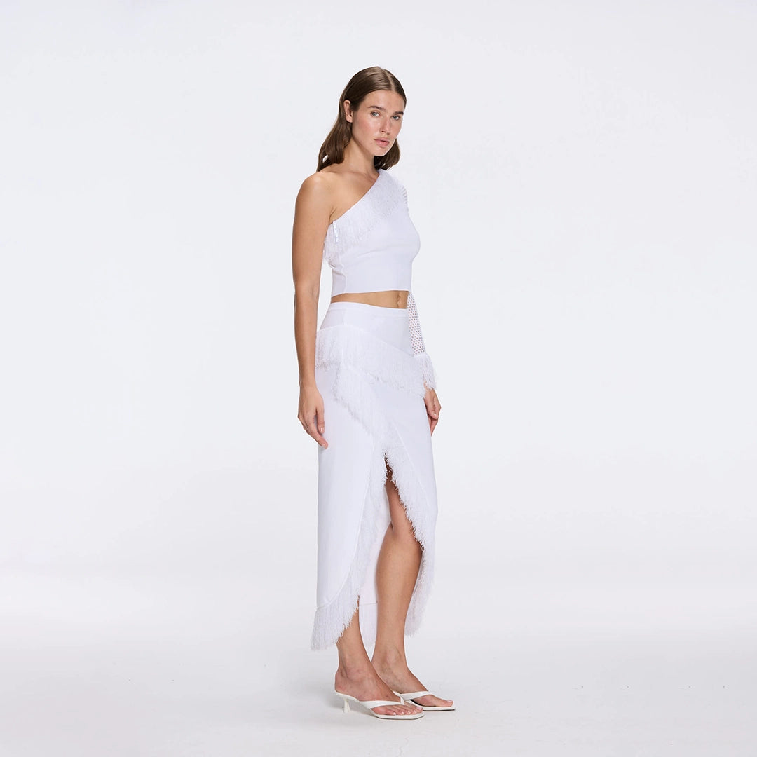 Monroe & Alani Fringe Asymmetric Knit White Set | Moeva | | Each week unveils new pieces—luxury swimwear, fluid resort silhouettes, and elevated summer-to-evening essentials designed to carry you from coastal escapes to city nights.