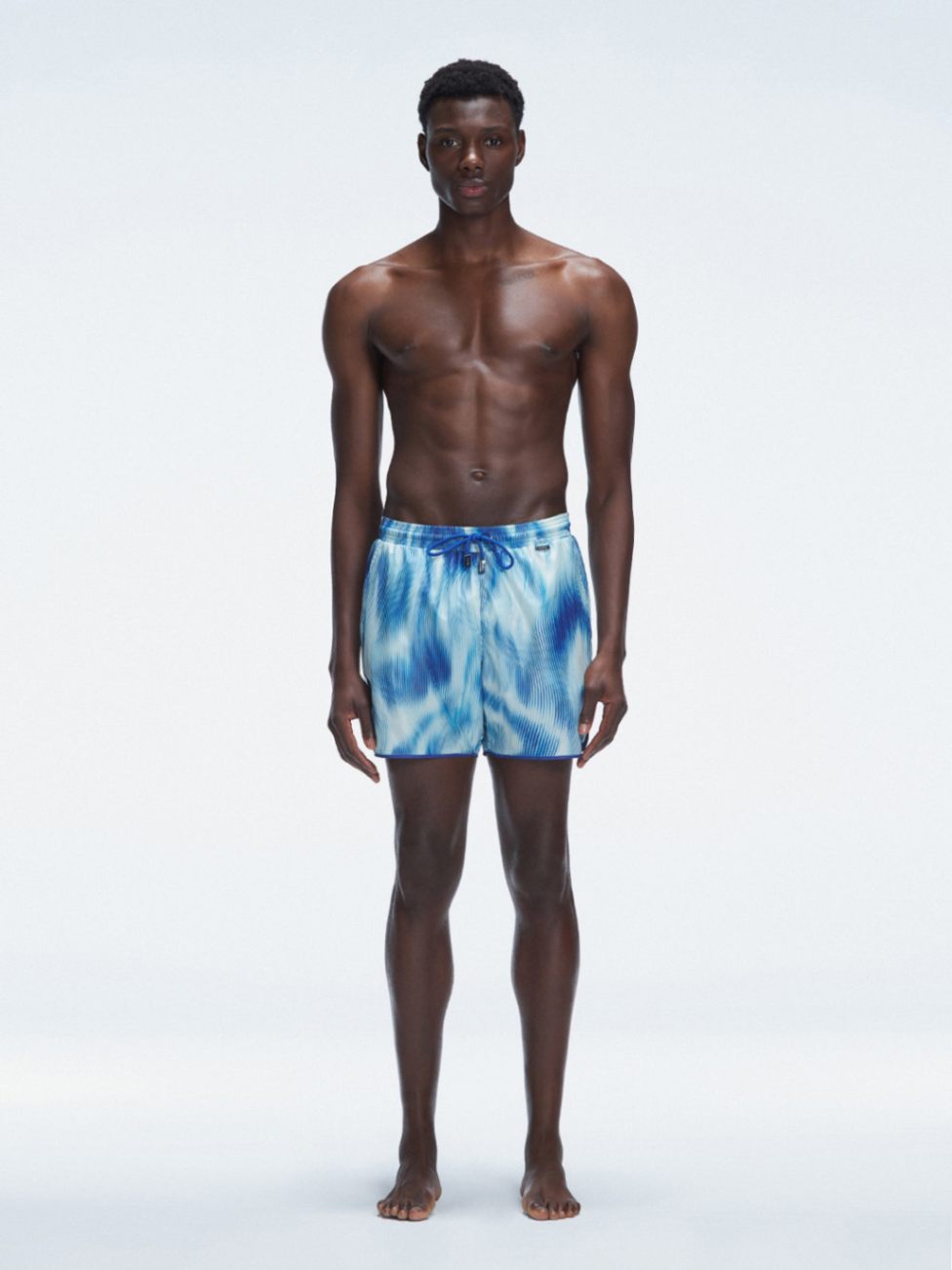 Griffin Blue Sonar Swim Shorts with front tie cords and side piping, laid flat for a detailed view.
